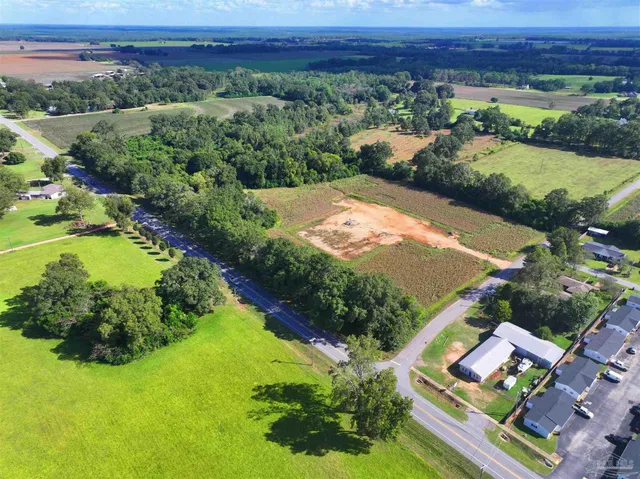 an aerial view of a golf course with a garden