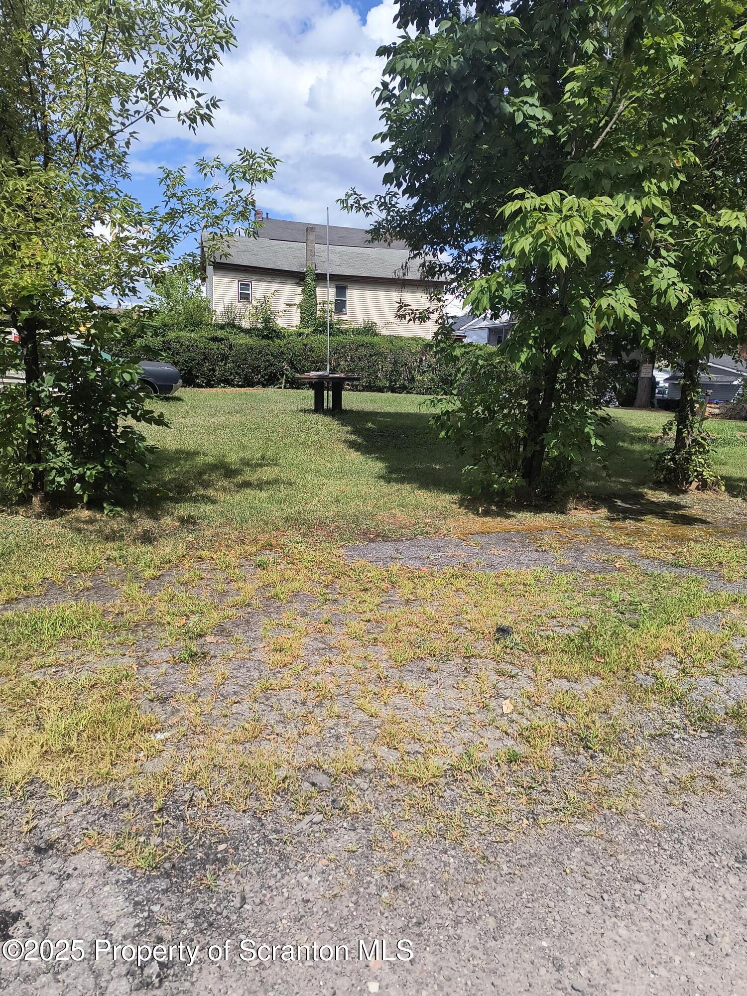12 Mill Street Carbondale, PA 18407 - Photo 3 of 6 a view of a house with a yard