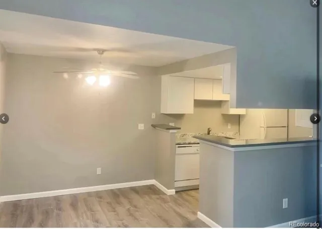 a kitchen with a sink cabinets and window