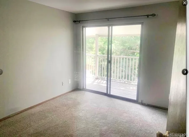 a view of an empty room and window