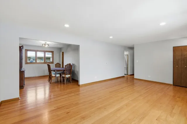 a view of dining room with furniture and wooden floor