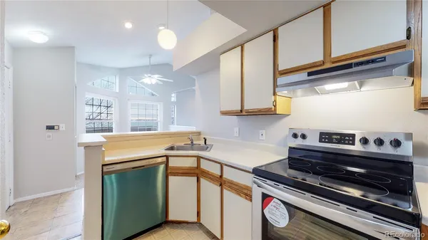 a kitchen that has a stove and a sink