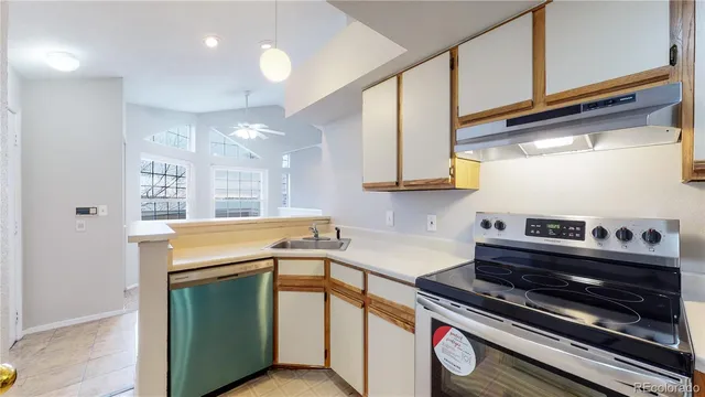 a kitchen that has a stove and a sink