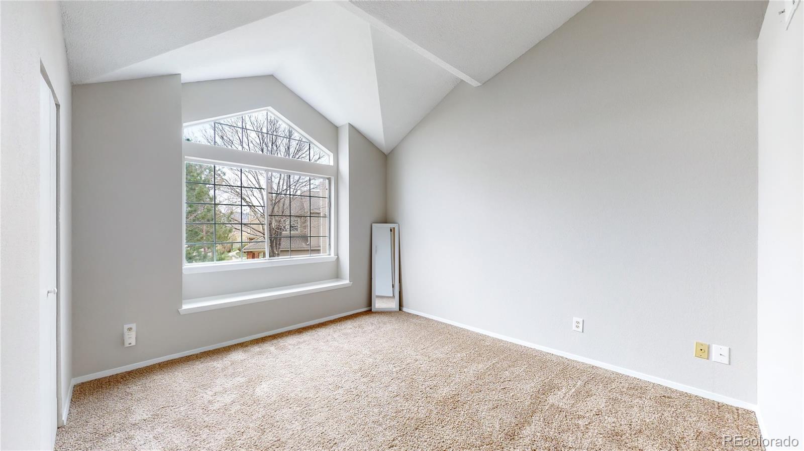 4760 South Wadsworth Boulevard, Unit F208 Littleton, CO 80123 - Photo 16 of 30 an empty room with windows