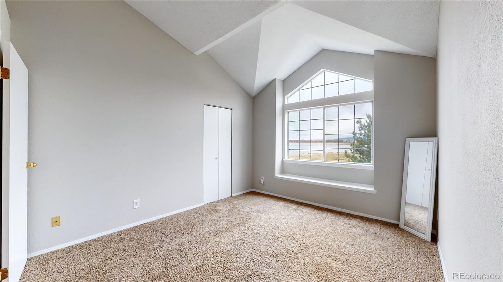4760 South Wadsworth Boulevard, Unit F208 Littleton, CO 80123 - Photo 17 of 30 a view of an empty room with a window