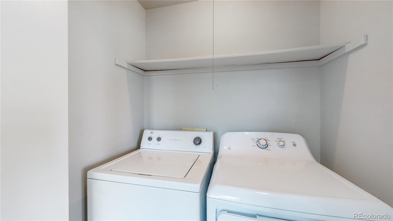 4760 South Wadsworth Boulevard, Unit F208 Littleton, CO 80123 - Photo 20 of 30 a utility room with dryer and washer