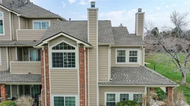 a view of a house with a yard from a terrace