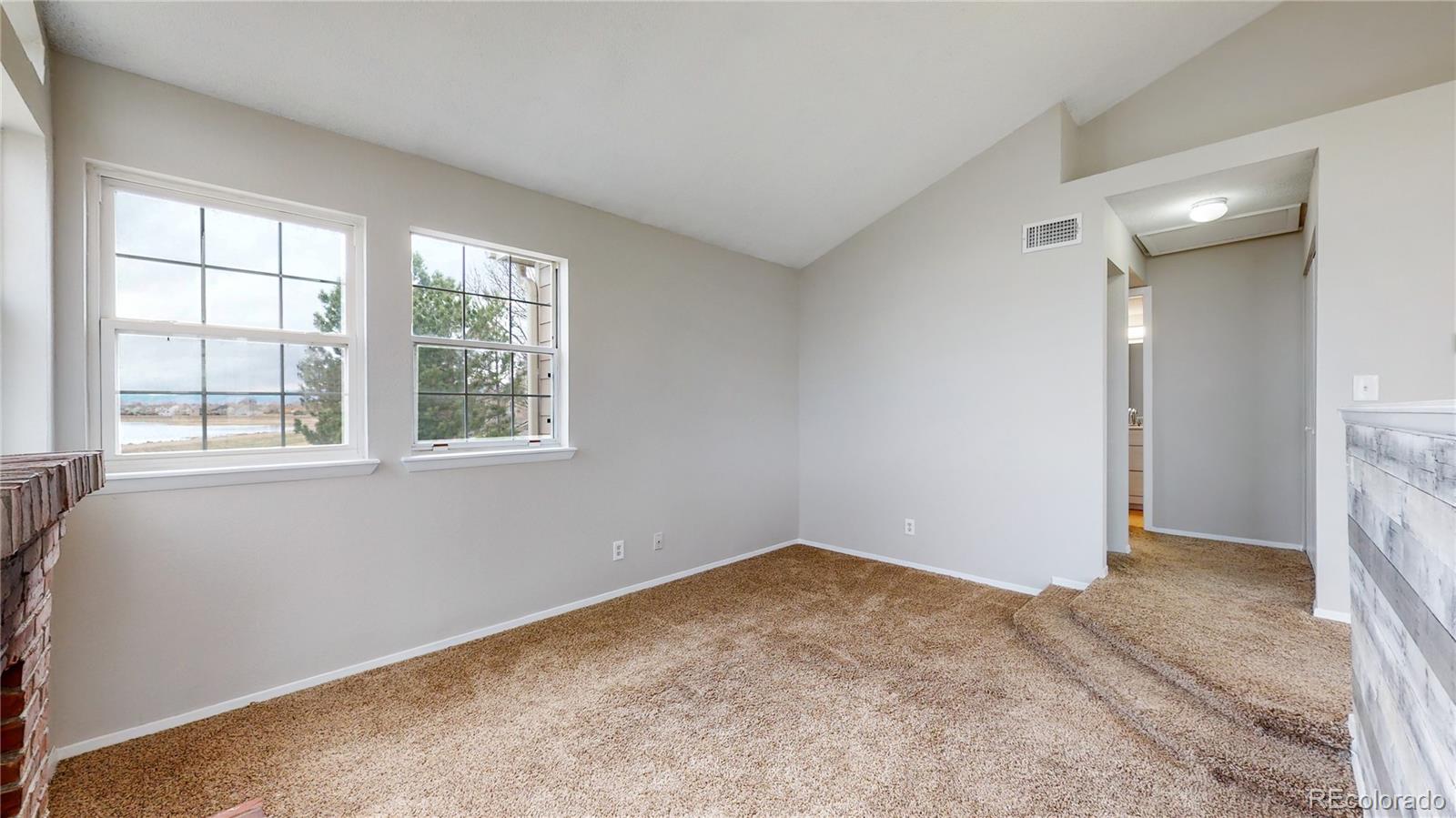 4760 South Wadsworth Boulevard, Unit F208 Littleton, CO 80123 - Photo 5 of 30 a view of an empty room with a window