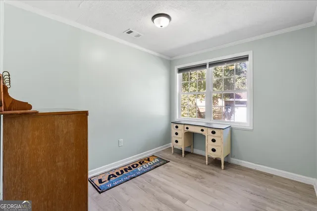 a room that has a dresser and a window