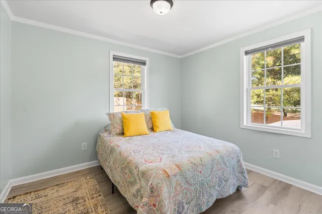 a bedroom with a bed and window