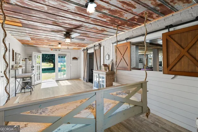 a view of a porch with seating space