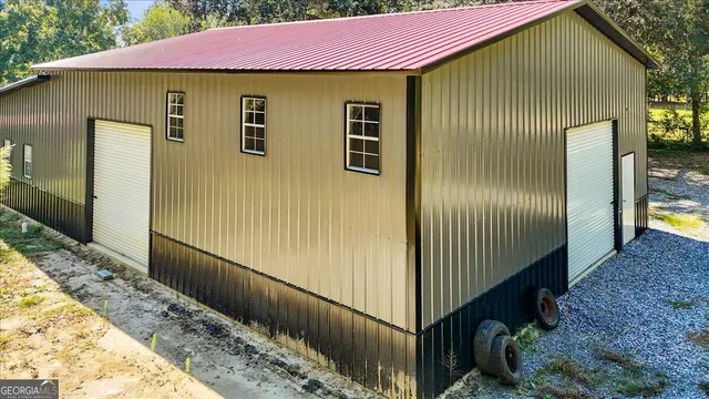 a front view of a house with wooden fence