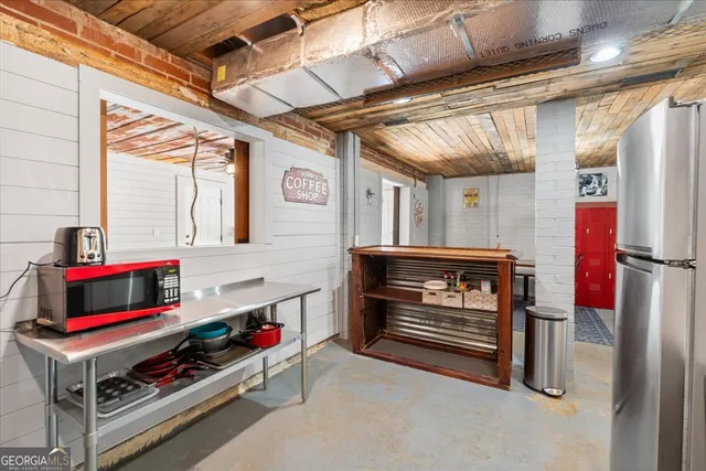 a room with furniture and pool table