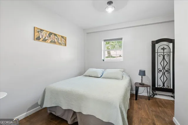 a bathroom with a toilet a sink and a mirror