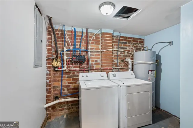 a view of a house with a yard covered in snow