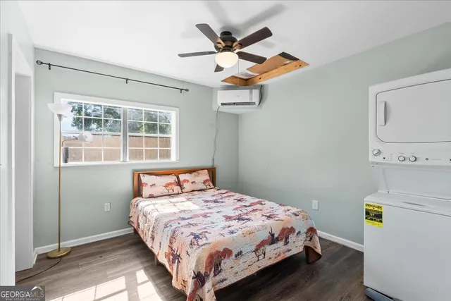 a bathroom with a sink and mirror with toilet
