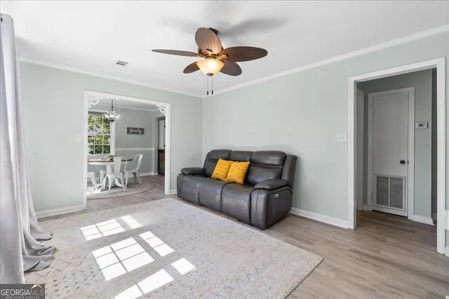 a living room with furniture and a window