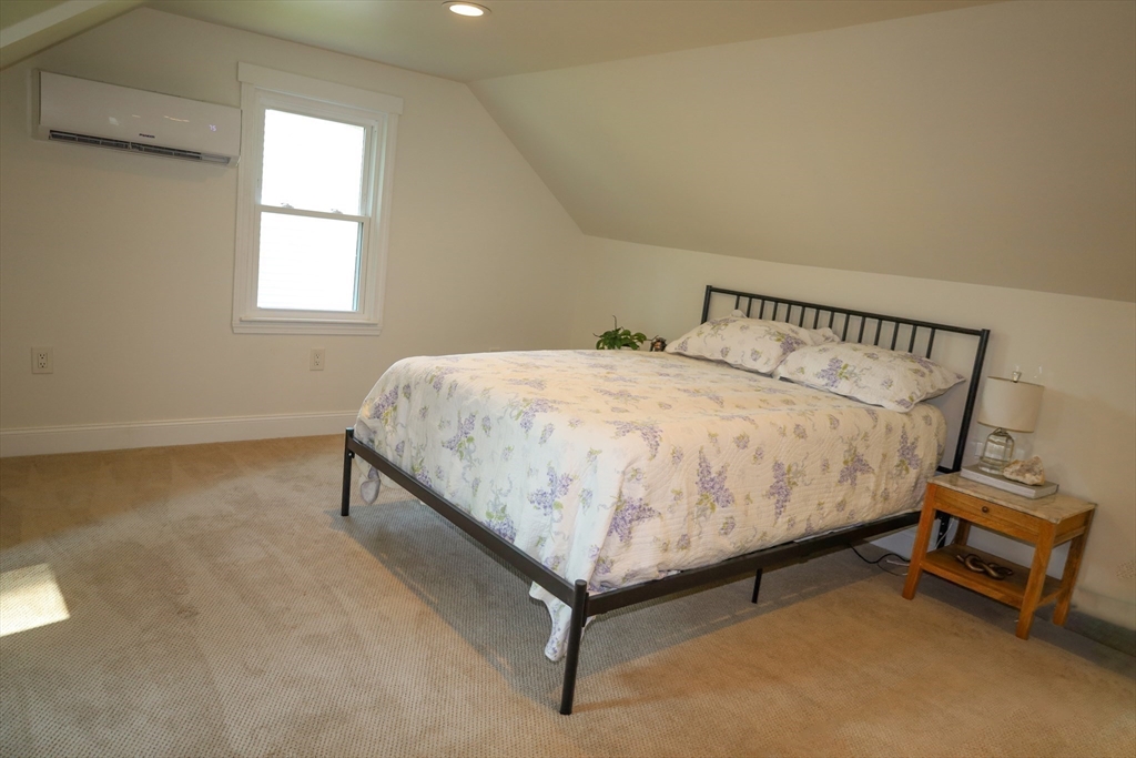 95 Mayflower Road Springfield, MA 01118 - Photo 16 of 20 a bedroom with a bed and window