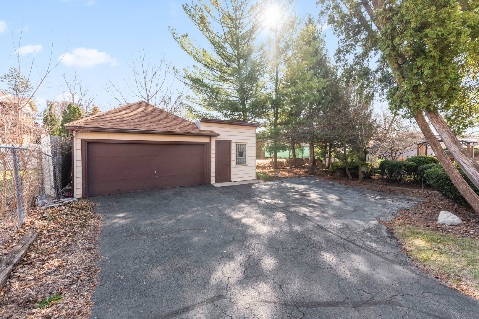 113 Elm Street, Unit C Elgin, IL 60123 - Photo 13 of 14 a front view of a house with a yard and garage
