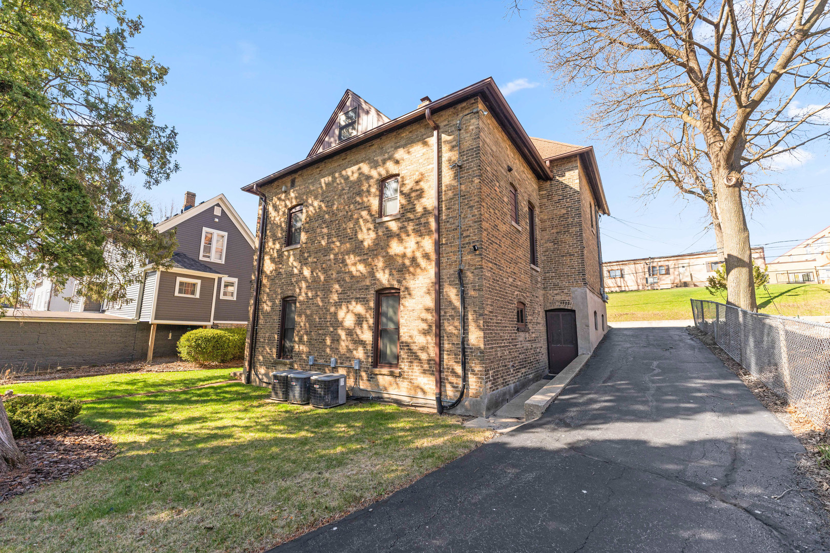 113 Elm Street, Unit C Elgin, IL 60123 - Photo 14 of 14 a front view of a house with garden