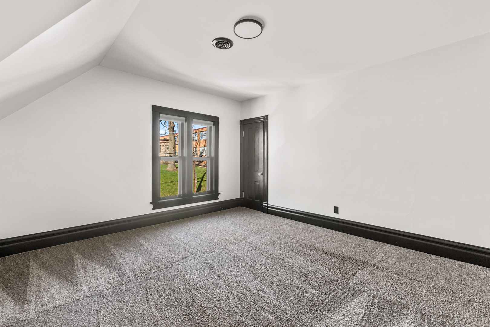 113 Elm Street, Unit C Elgin, IL 60123 - Photo 5 of 14 a view of an empty room with window