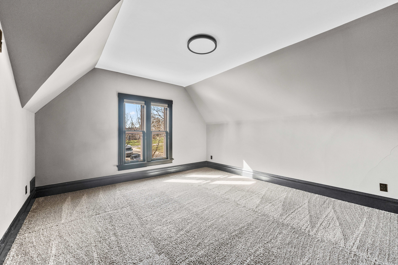 113 Elm Street, Unit C Elgin, IL 60123 - Photo 6 of 14 a view of an empty room with a window
