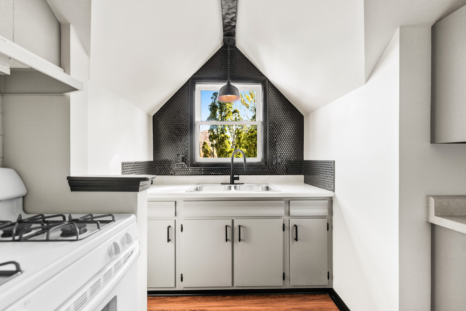 113 Elm Street, Unit C Elgin, IL 60123 - Photo 10 of 14 a kitchen with a sink stove and cabinets