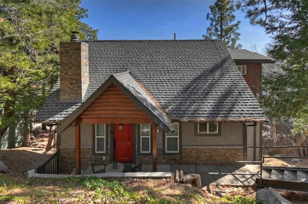 27565 North Bay Road Lake Arrowhead, CA 92352 - Photo 2 of 58 a front view of a house with garden