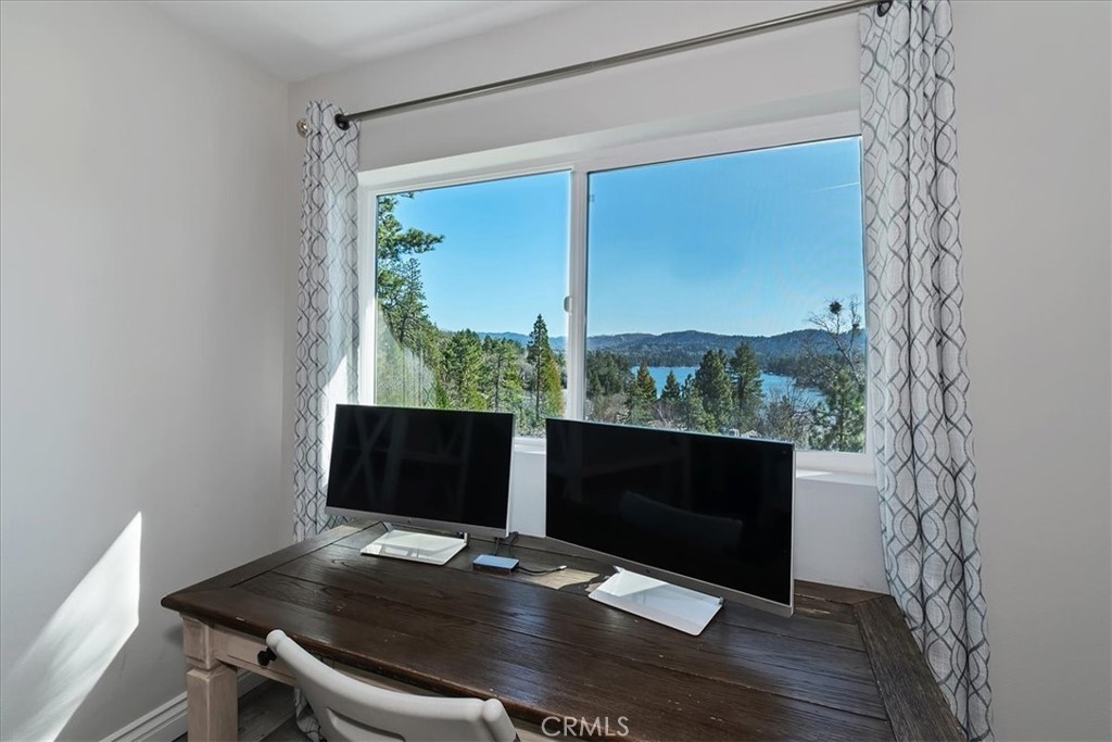 27565 North Bay Road Lake Arrowhead, CA 92352 - Photo 22 of 58 a desktop computer sitting on top of a desk