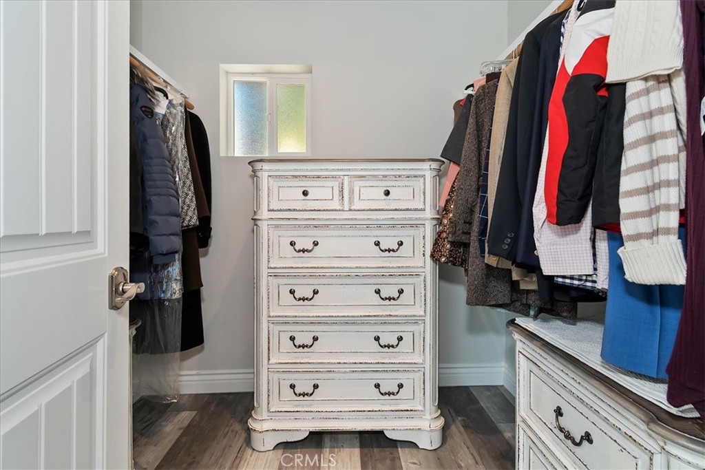 27565 North Bay Road Lake Arrowhead, CA 92352 - Photo 26 of 58 a view of walk in closet with clothes and shoes