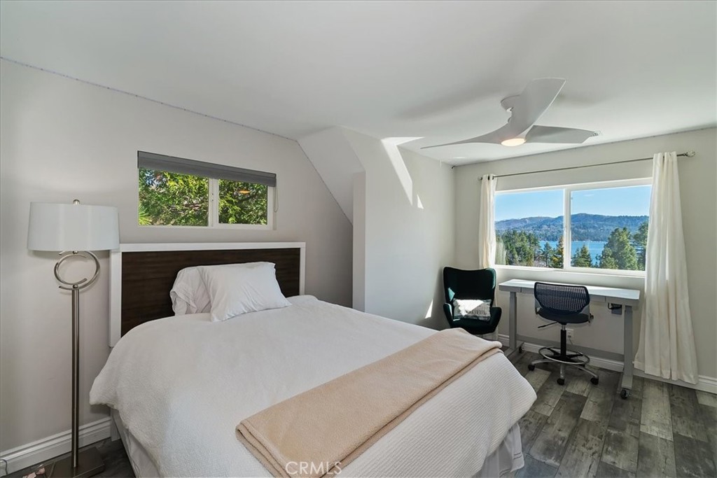 27565 North Bay Road Lake Arrowhead, CA 92352 - Photo 27 of 58 a bedroom with a large bed and a window