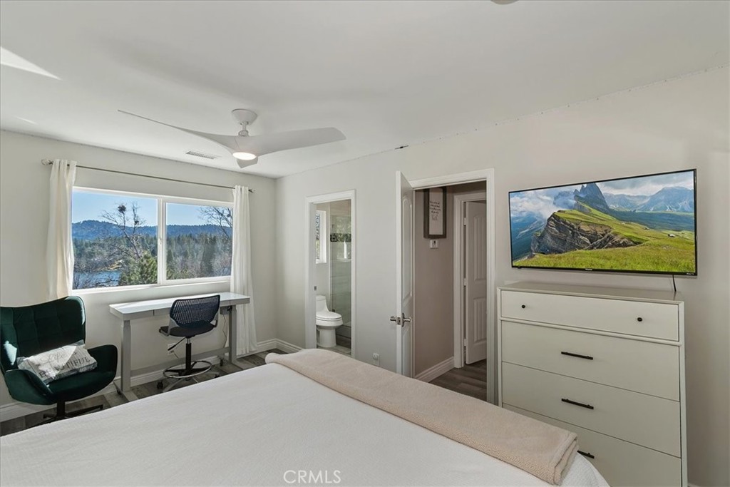 27565 North Bay Road Lake Arrowhead, CA 92352 - Photo 28 of 58 a bedroom with a bed and wooden floor