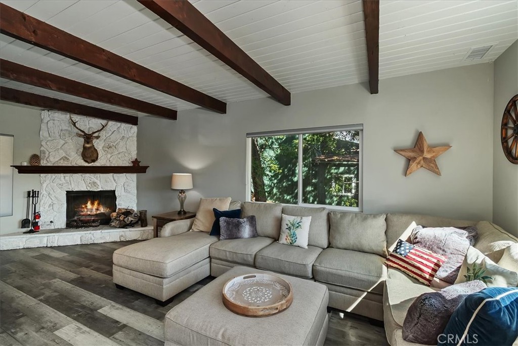 27565 North Bay Road Lake Arrowhead, CA 92352 - Photo 33 of 58 a living room with furniture and a fireplace