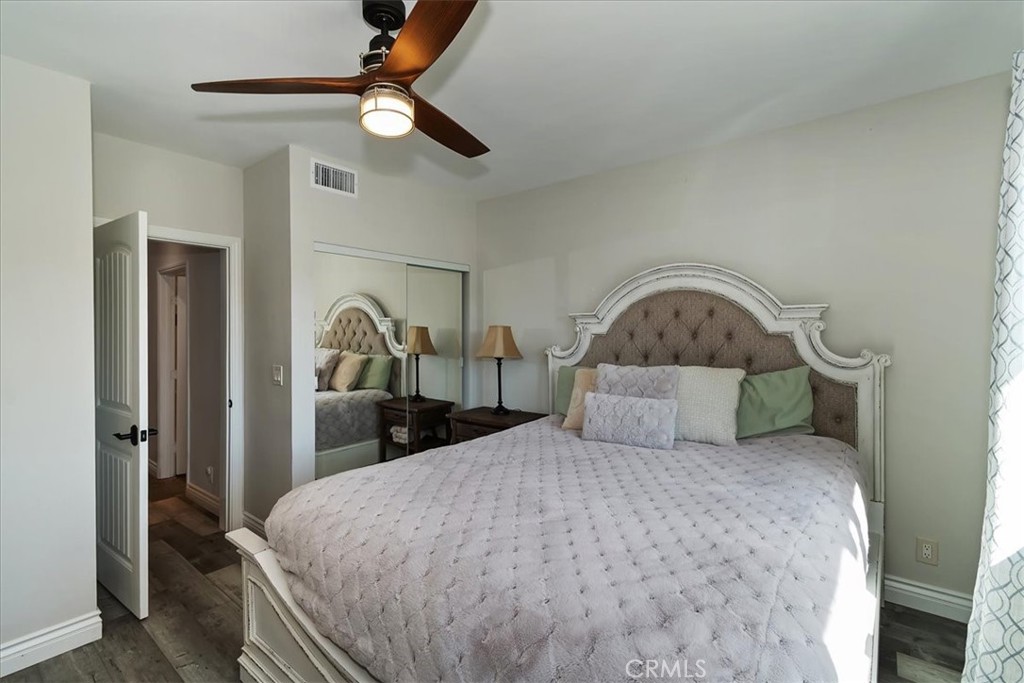 27565 North Bay Road Lake Arrowhead, CA 92352 - Photo 36 of 58 a bedroom with a bed a ceiling fan and a dresser