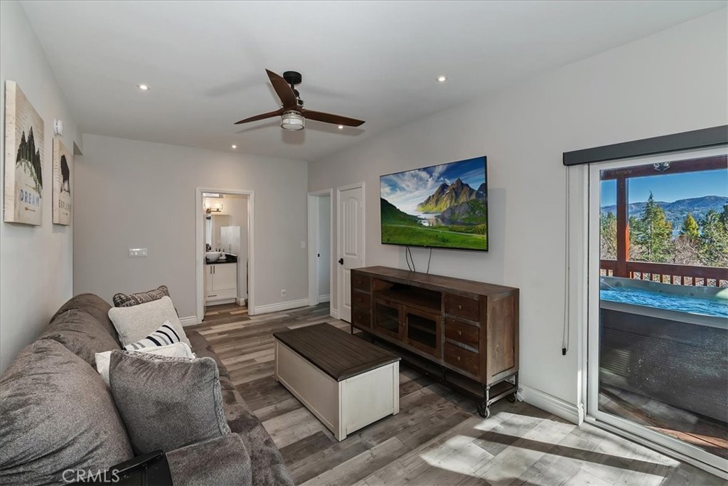 27565 North Bay Road Lake Arrowhead, CA 92352 - Photo 41 of 58 a living room with furniture a flat screen tv and a fireplace