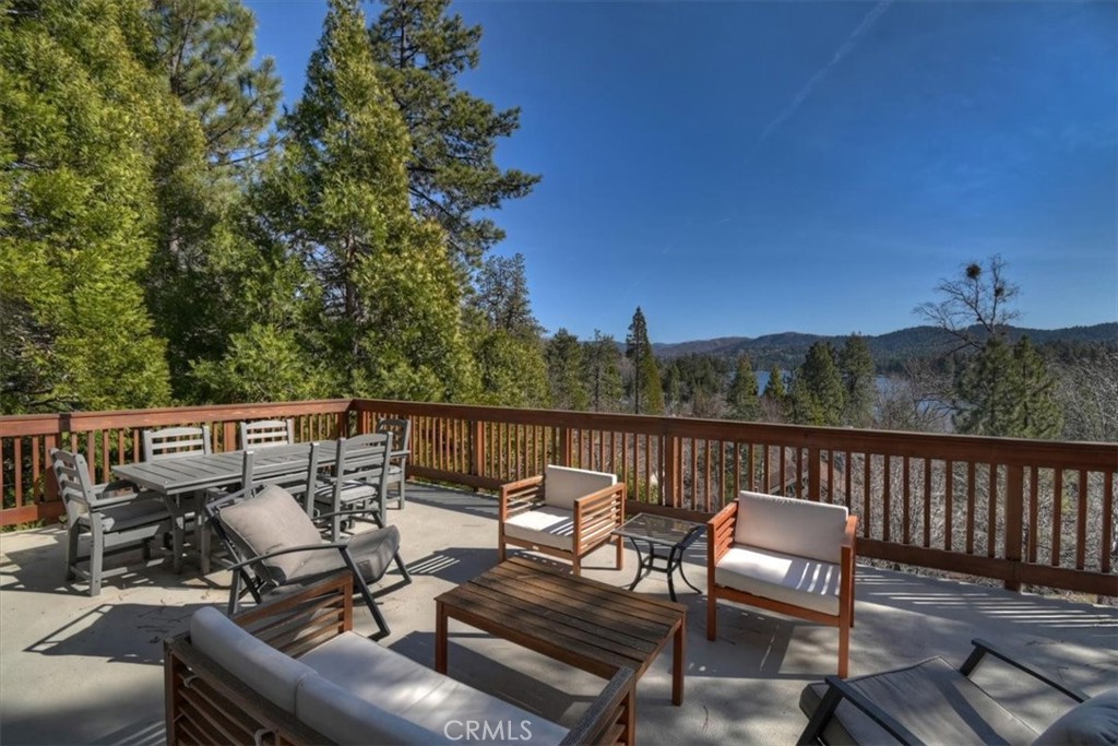 27565 North Bay Road Lake Arrowhead, CA 92352 - Photo 47 of 58 a balcony with wooden floor and outdoor seating