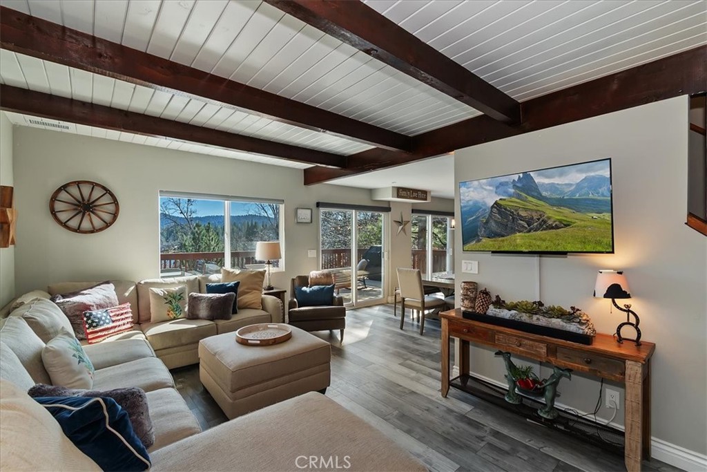 27565 North Bay Road Lake Arrowhead, CA 92352 - Photo 7 of 58 a living room with furniture a rug and a large window