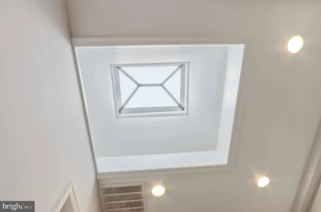 a bathroom with a shower and a sink