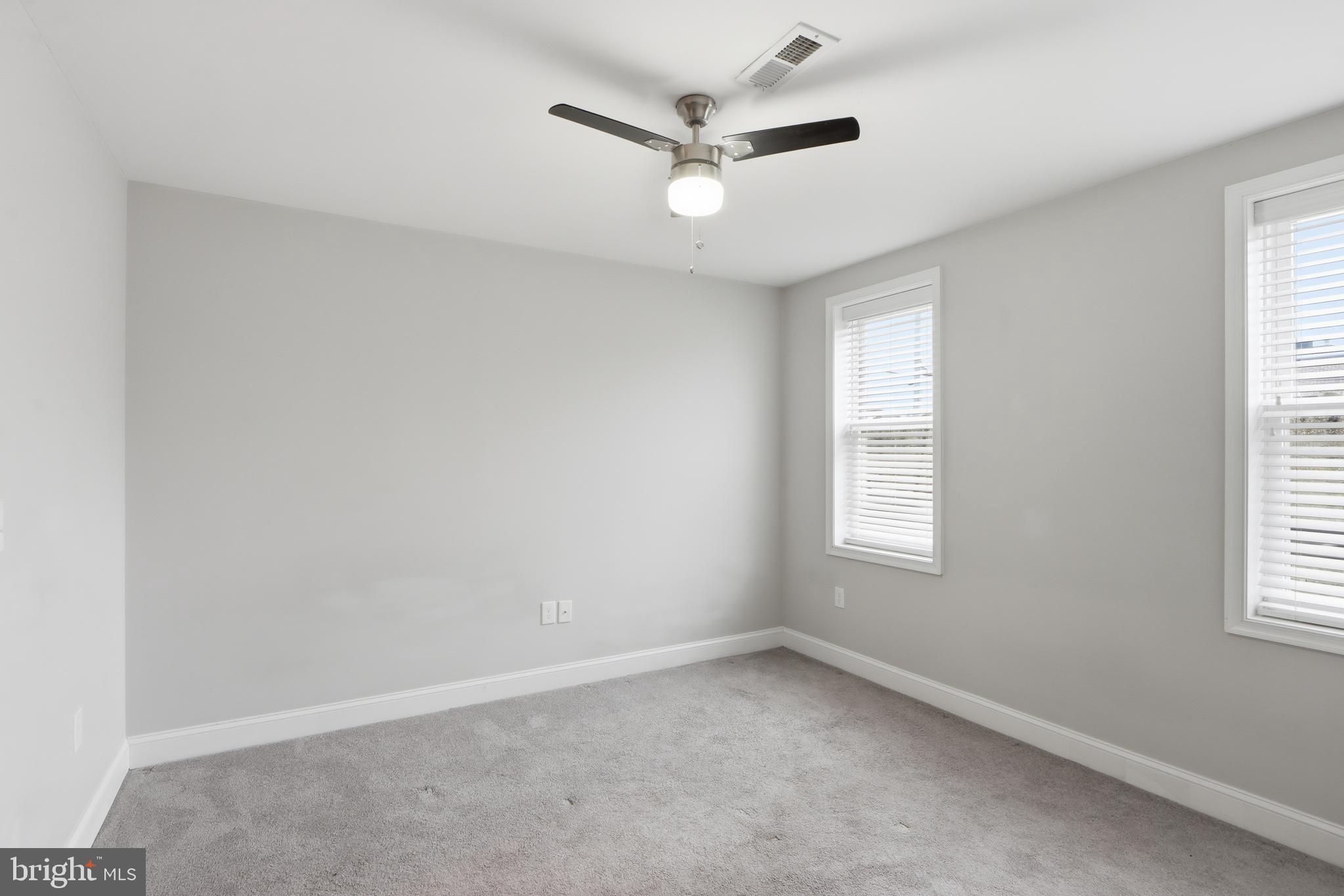 3540 Keswick Road Baltimore, MD 21211 - Photo 20 of 41 an empty room with a window and a ceiling fan
