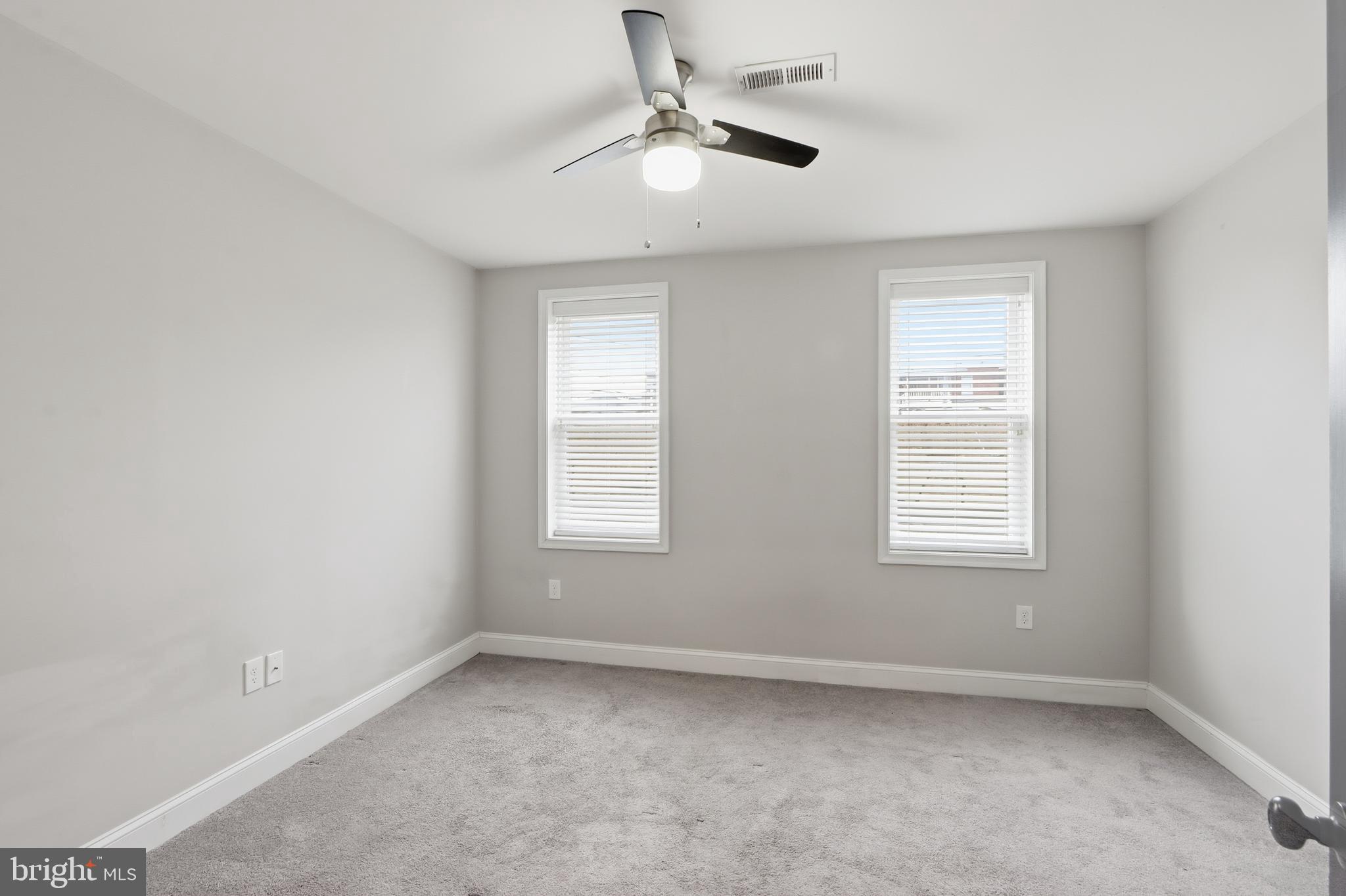 3540 Keswick Road Baltimore, MD 21211 - Photo 21 of 41 an empty room with a window and a fan