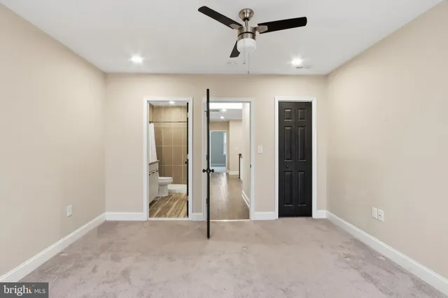 an empty room with closet area