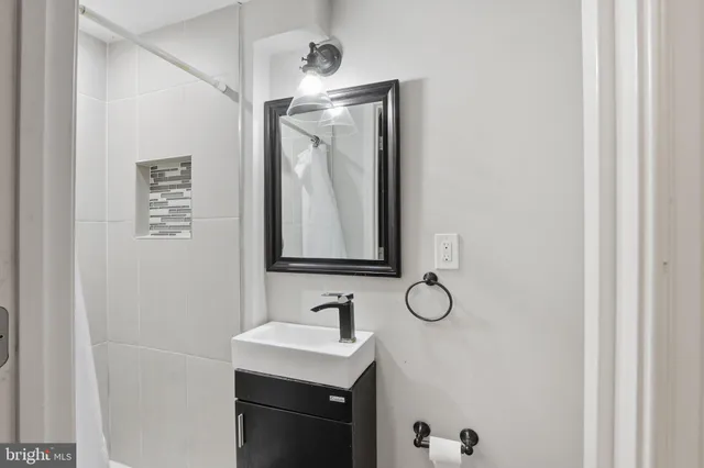 a bathroom with a sink and a mirror