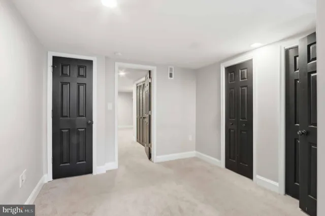 a view of an empty room with stairs