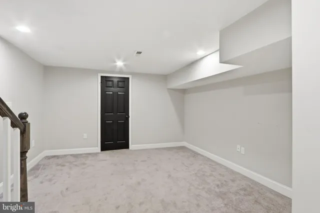 a front view of a building with a porch