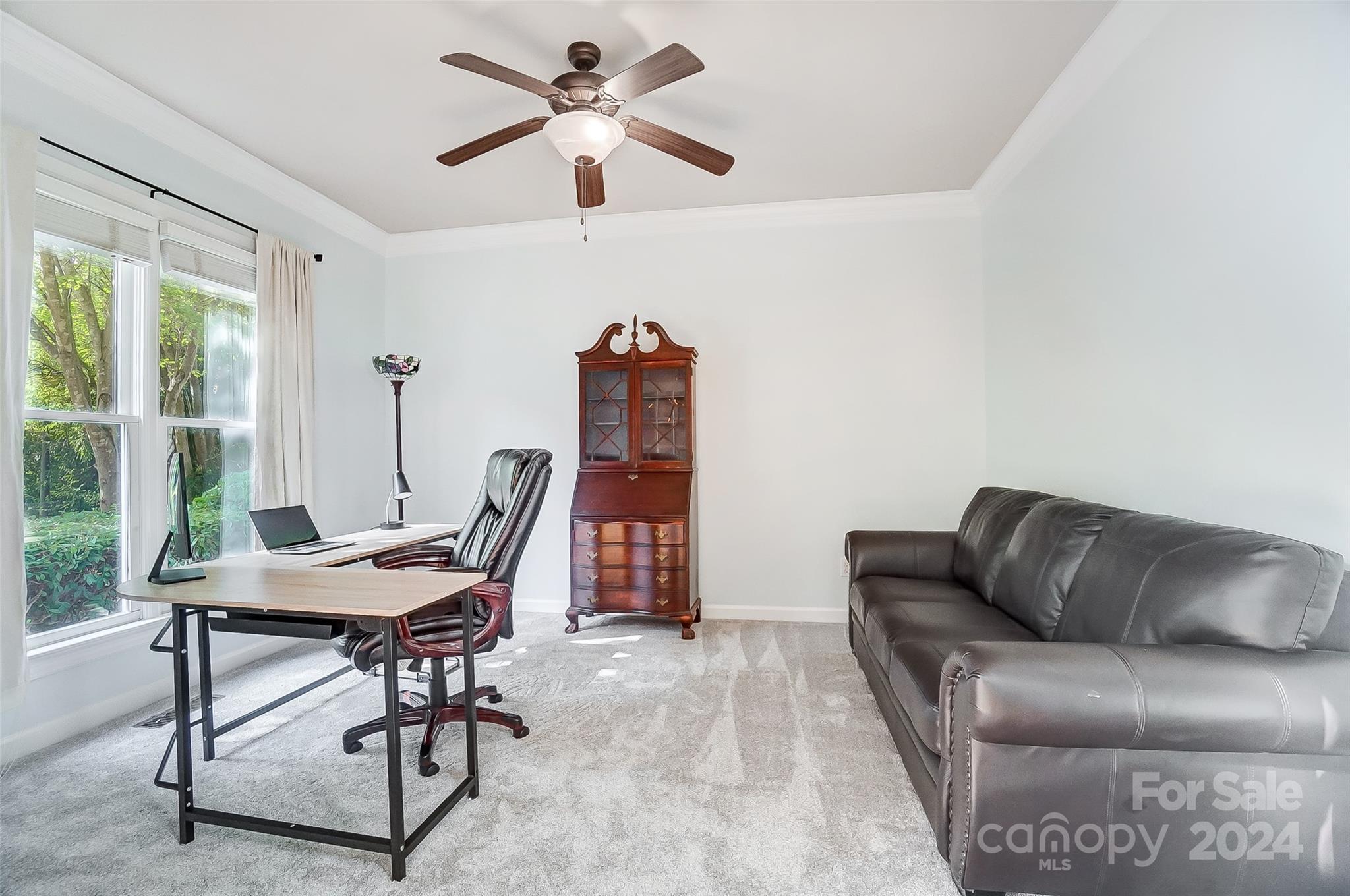 15110 MacBeth Court Huntersville, NC 28078 - Photo 12 of 36 a view of a livingroom with furniture and a window