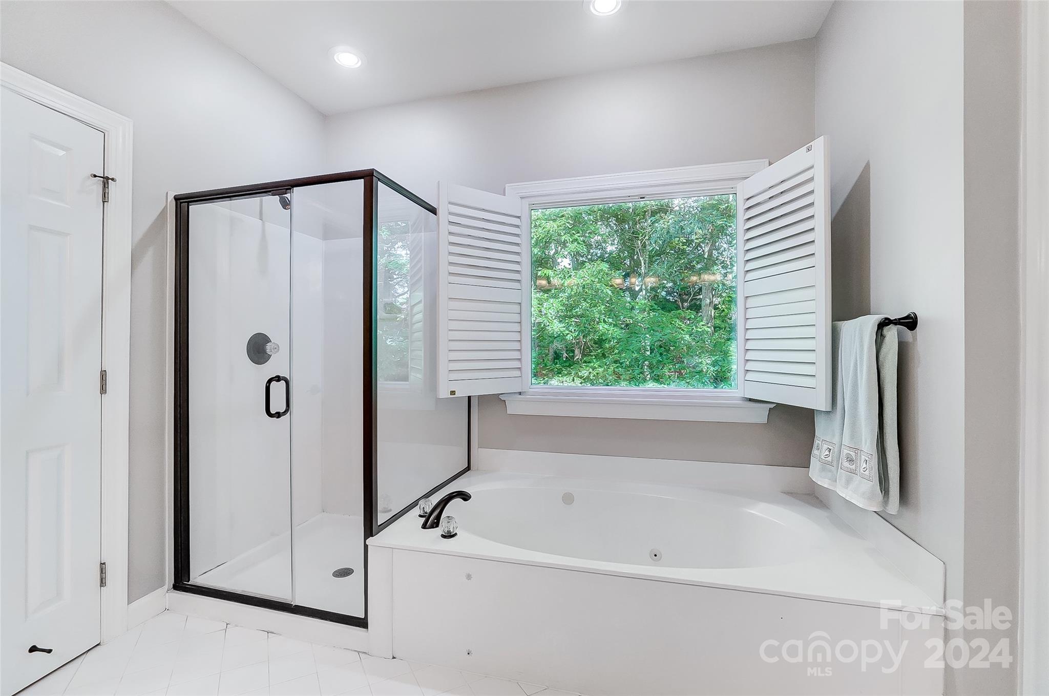 15110 MacBeth Court Huntersville, NC 28078 - Photo 18 of 36 a bathroom with a bathtub and a shower