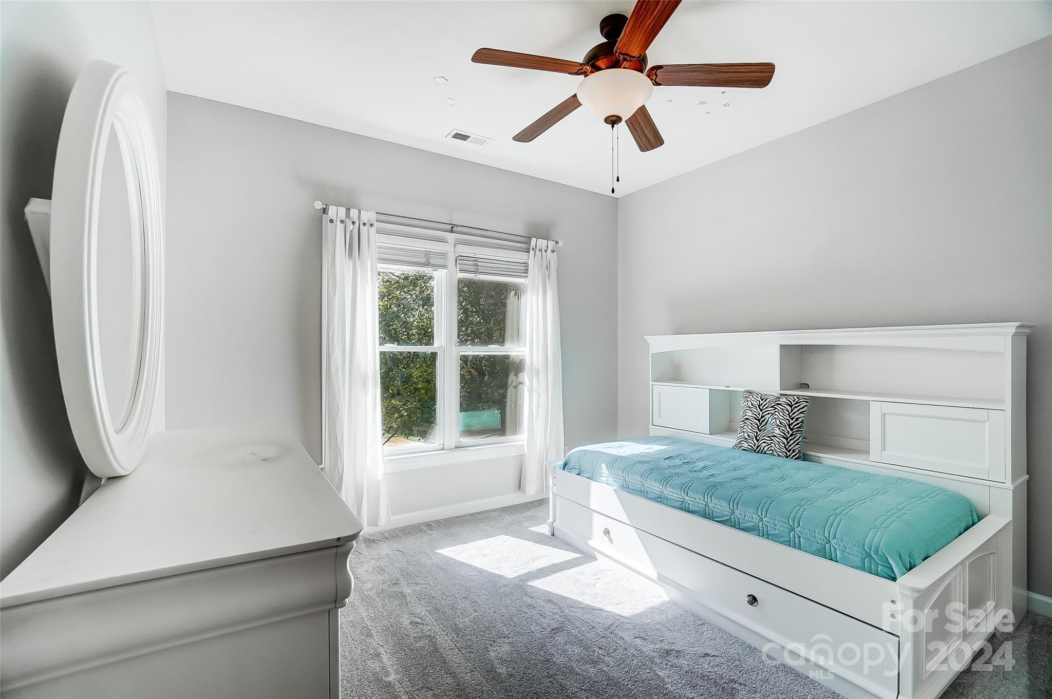 15110 MacBeth Court Huntersville, NC 28078 - Photo 20 of 36 a bedroom with a bed and window