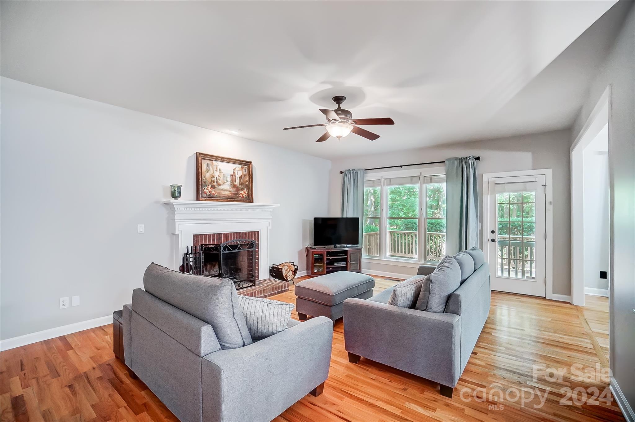 15110 MacBeth Court Huntersville, NC 28078 - Photo 2 of 36 a living room with furniture and a fireplace