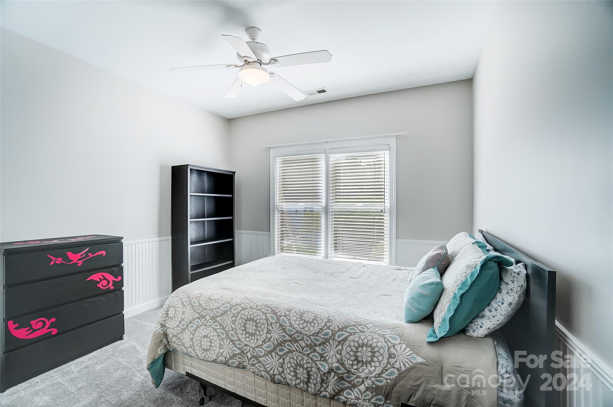 15110 MacBeth Court Huntersville, NC 28078 - Photo 21 of 36 a bedroom with a bed and a window