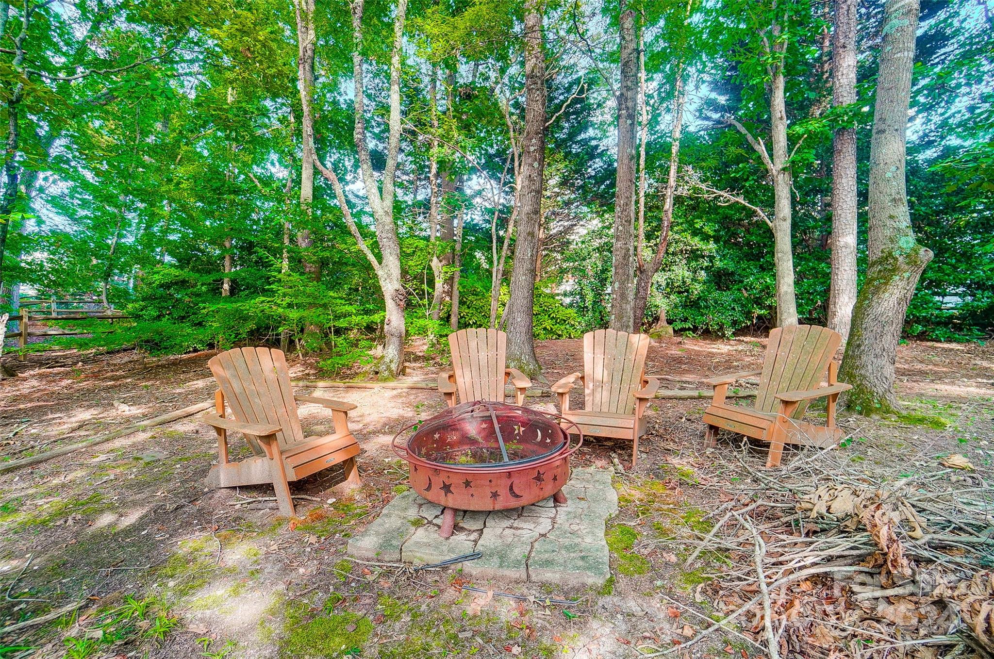 15110 MacBeth Court Huntersville, NC 28078 - Photo 25 of 36 a view of a chairs and table in backyard